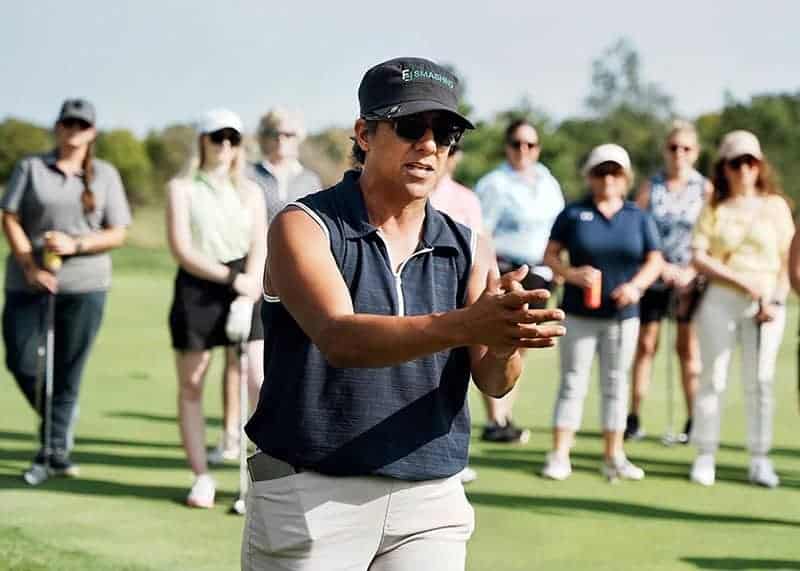Far Samji coaching a group of women on the driving range