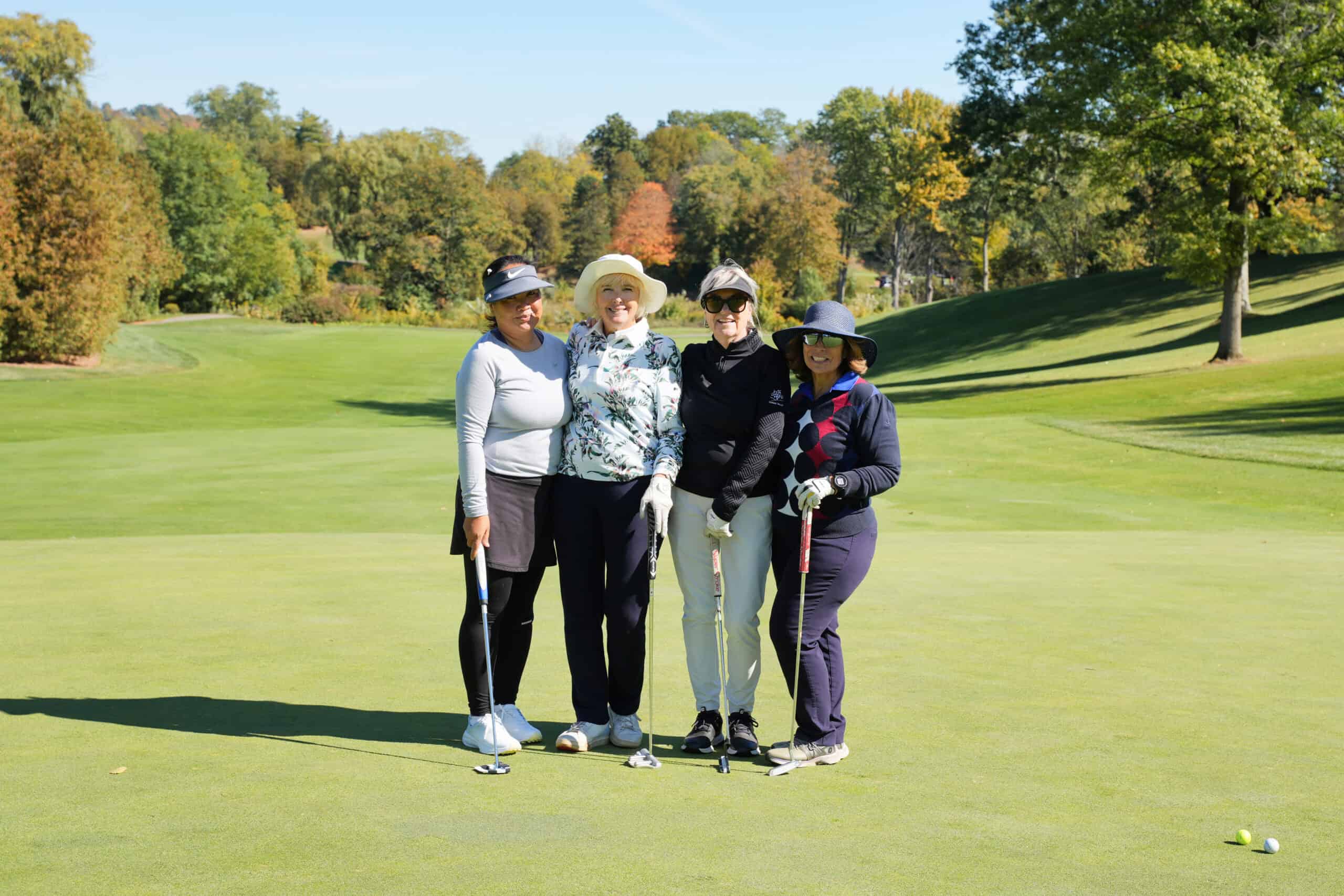 Four women golfers on the course at Smashing Nines