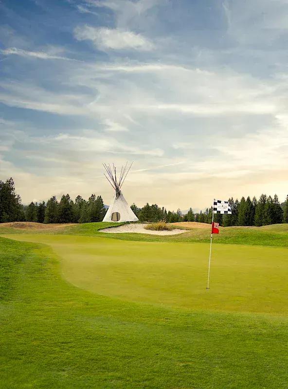Green with a teepee behind it at St. Eugene Golf Resort in Cranbrook, B.C.